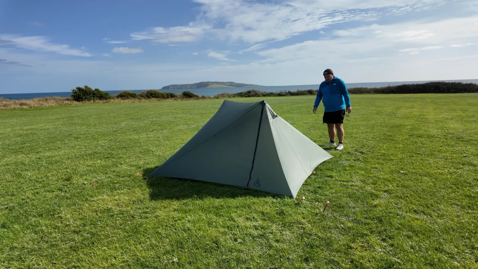 The Durston X-Mid 2 fully pitched on a coastal field with the sea behind